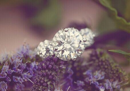 Large diamond ring on purple flowers